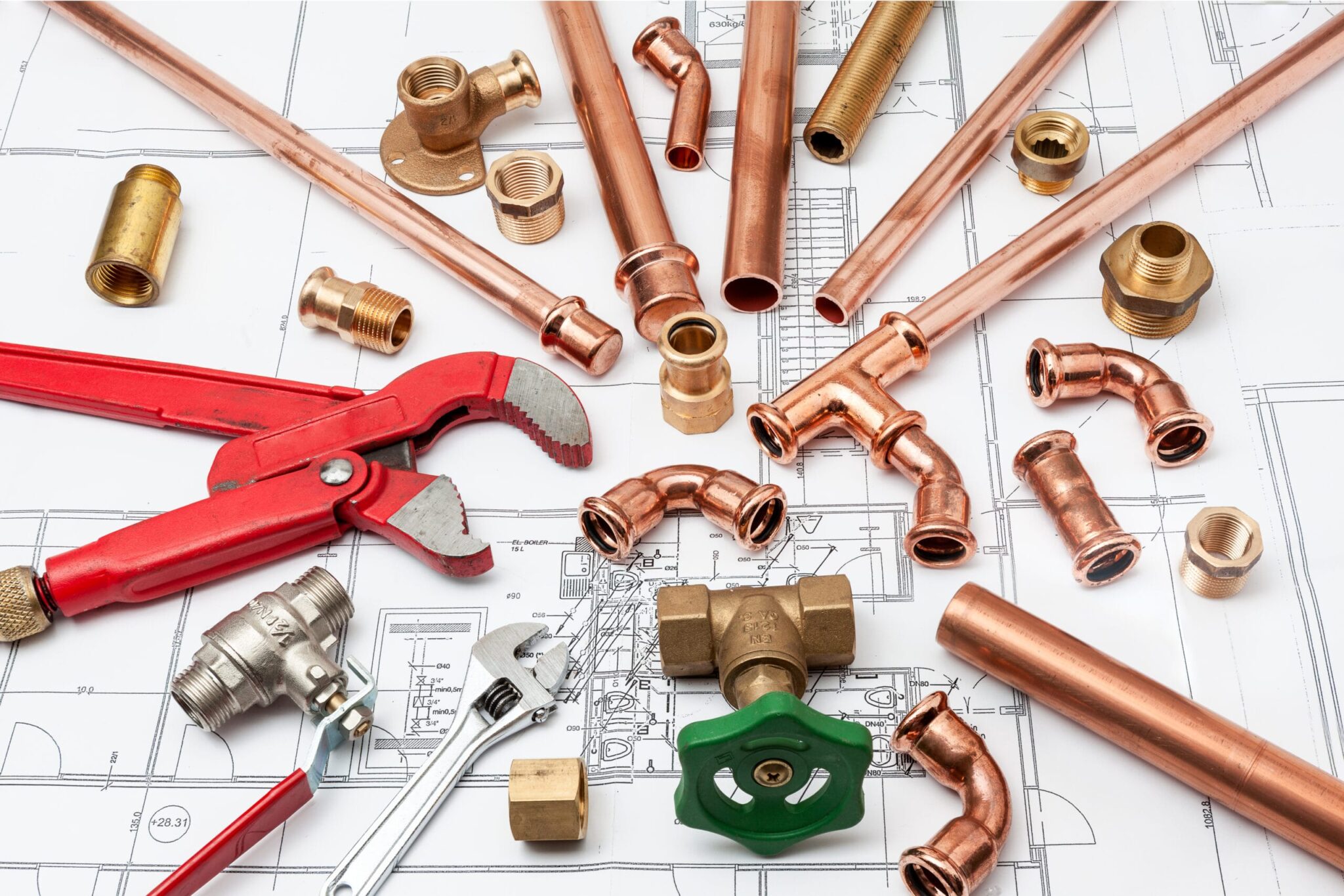 Copper pipes, fittings, valves, and plumbing tools in Longmont