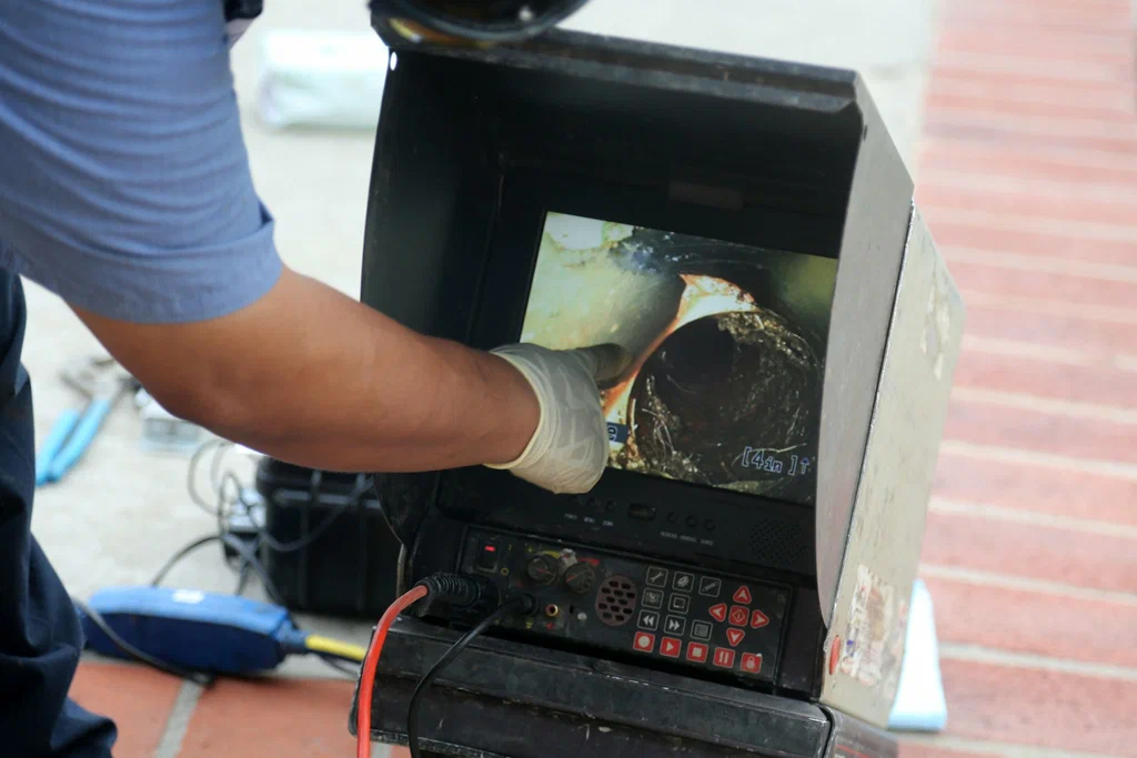 Technician viewing a drain inspection camera in Longmont